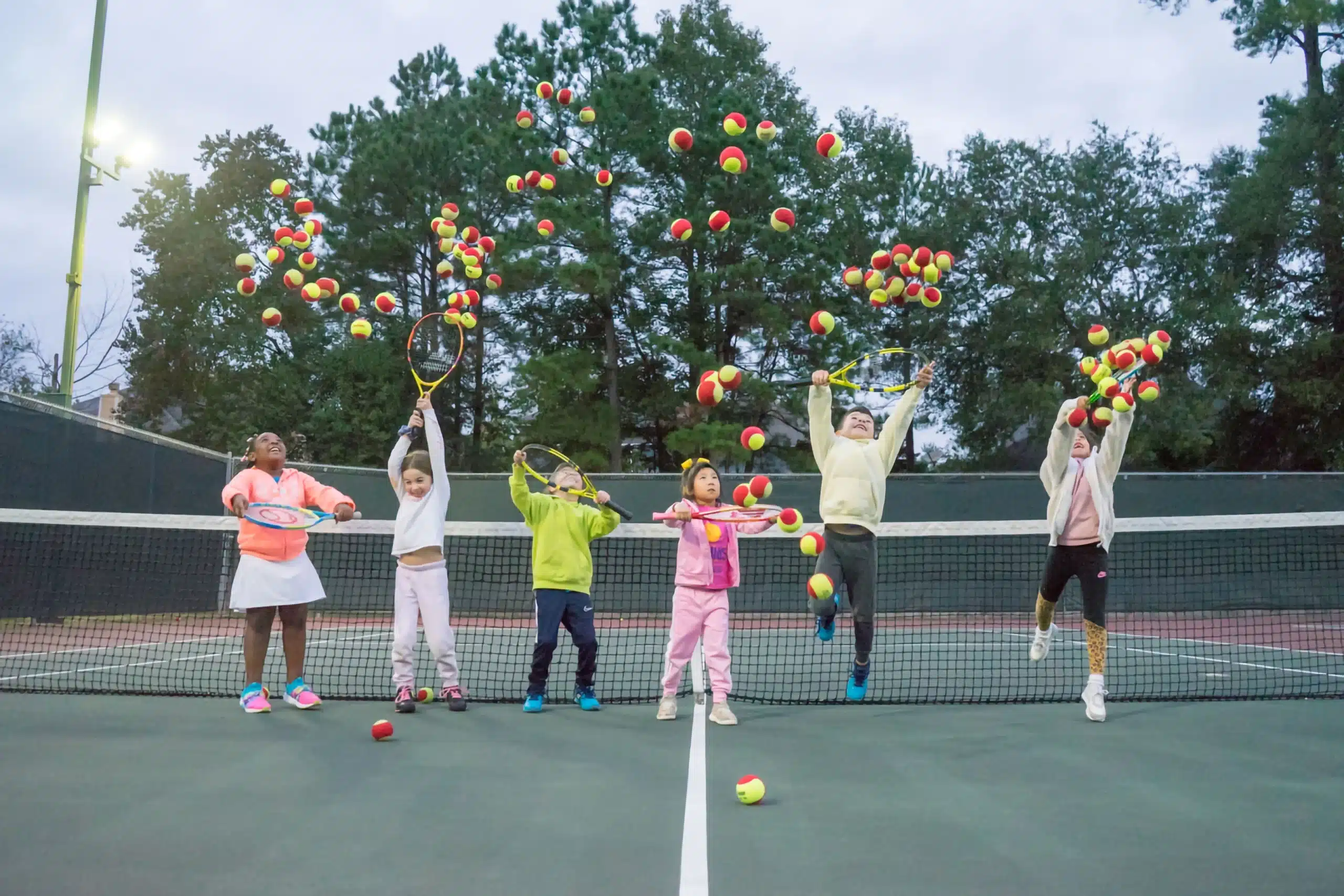 a group of kids playing tennis Tennis Camps in Spring, TX - a group of kids playing tennis